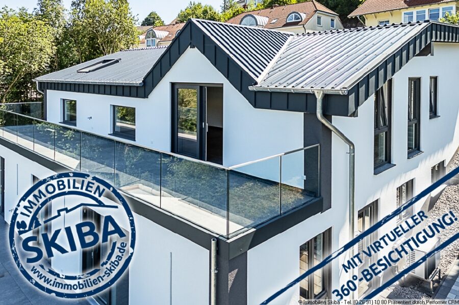 Erstbezug: Moderne Neubau-Erdgeschoss-Eigentumswohnung mit 2 Garagen in Daun-Pützborn - Blick auf den Balkon